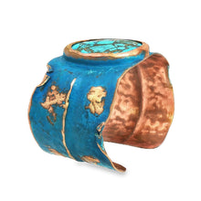 Load image into Gallery viewer, a blue and copper bracelet with a turquoise stone in the center.