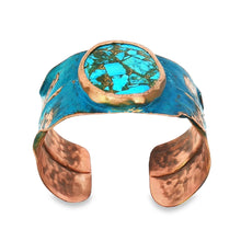 Load image into Gallery viewer, A colorful bracelet with a large turquoise stone in the center, surrounded by copper-colored metal.