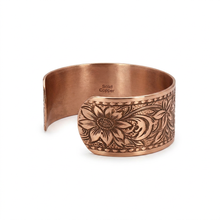 Load image into Gallery viewer, A copper-colored bracelet with an intricate floral design.
