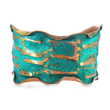 Load image into Gallery viewer, A colorful, textured cuff bracelet with a mix of green and gold colors.