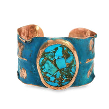 Load image into Gallery viewer, A turquoise and copper cuff bracelet with a large turquoise stone in the center.