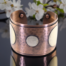 Load image into Gallery viewer, a close up of a vase with flowers in the background

