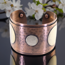 Load image into Gallery viewer, a close up of a vase with flowers in the background