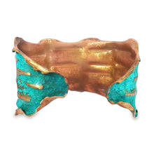 Load image into Gallery viewer, a unique, handcrafted bracelet made of copper and turquoise materials. The bracelet has a distinctive, organic shape with a combination of copper and turquoise colors, giving it a striking and eye-catching appearance.
