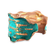 Load image into Gallery viewer, a piece of art with a unique, textured surface that appears to be a combination of copper and turquoise colors. The piece is described as a bracelet, but it is not possible to determine the exact type of bracelet based on the image alone.
