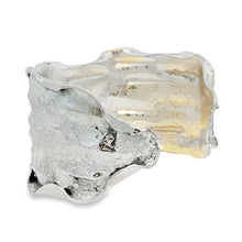 Load image into Gallery viewer, a unique, textured bracelet made of a shiny, metallic material.
