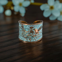 Load image into Gallery viewer, Solid Copper Patina Concave Cuff Ring with Hummingbird &amp; Floral Motif &amp; Light Verdigris Patina
